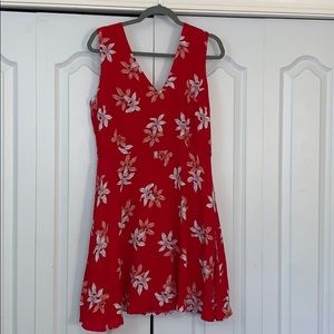 Red floral, v-neck, tie back, full skirt.